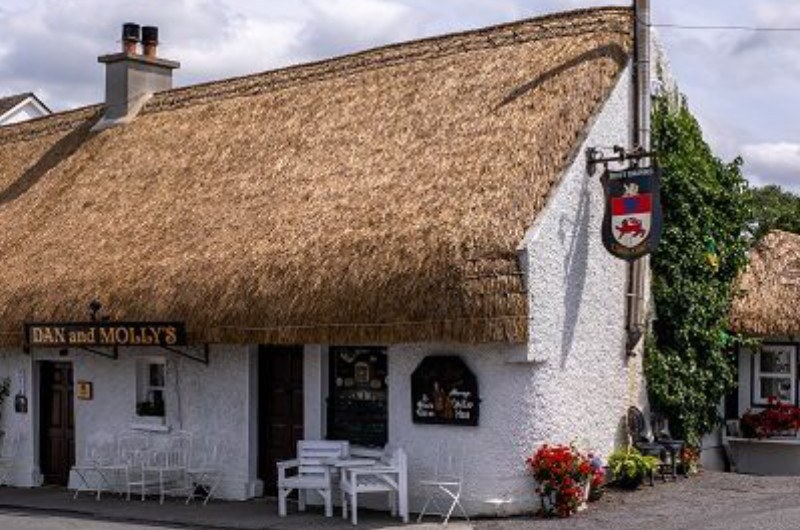 Thatched Roof Pub Named Dan and Mollys