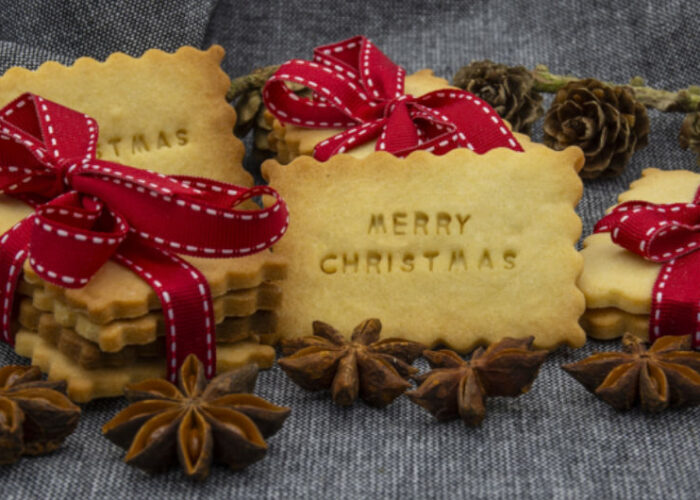 Merry Christmas cookies with red ribbons and anise
