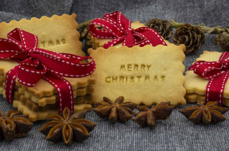 Merry Christmas cookies with red ribbons and anise