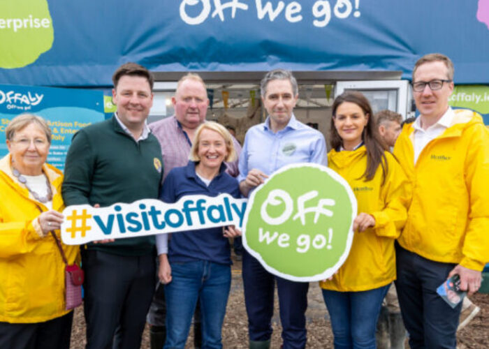 Group holding Visitoffaly and Off We Go signs