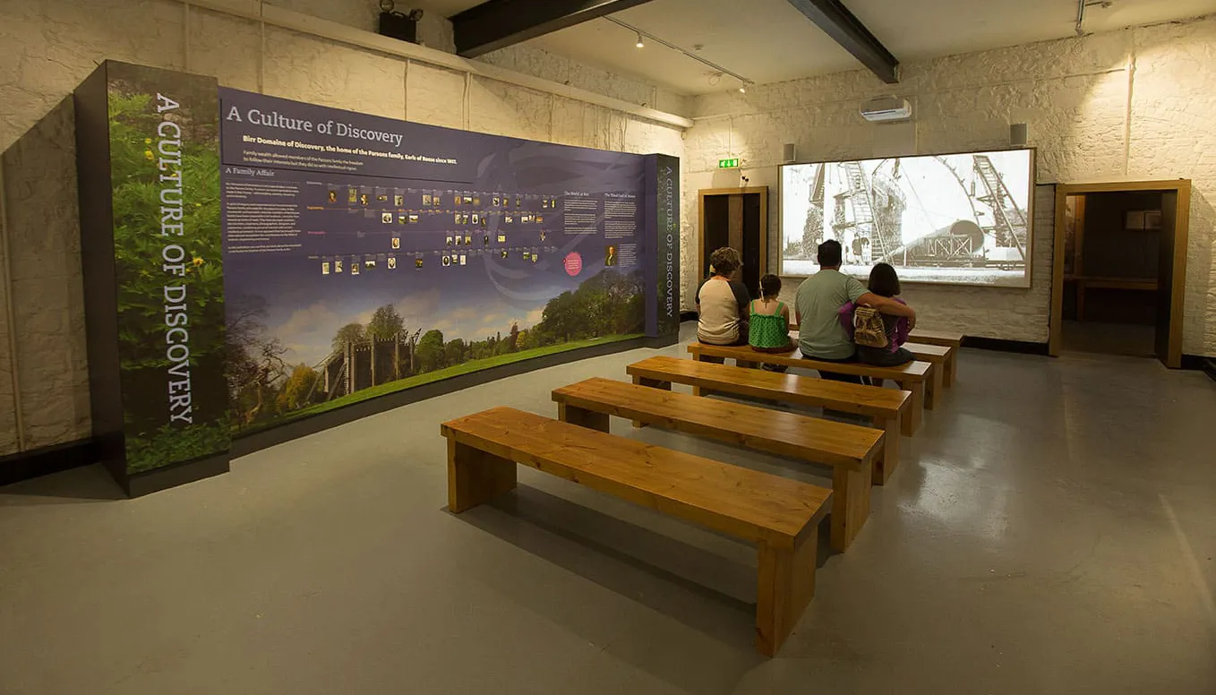 tourist office family watching info video