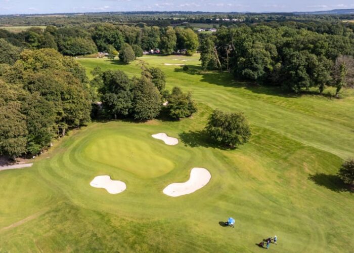 Aerial view of golf green and sand bunkers
