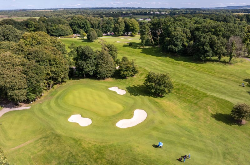Aerial view of golf green and sand bunkers