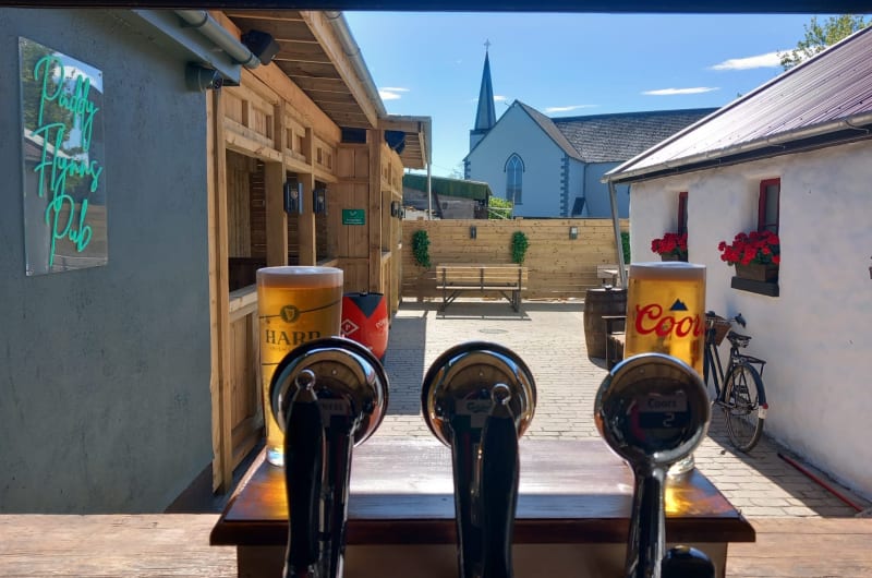 Beer taps and pints at Paddy Flyns Pub