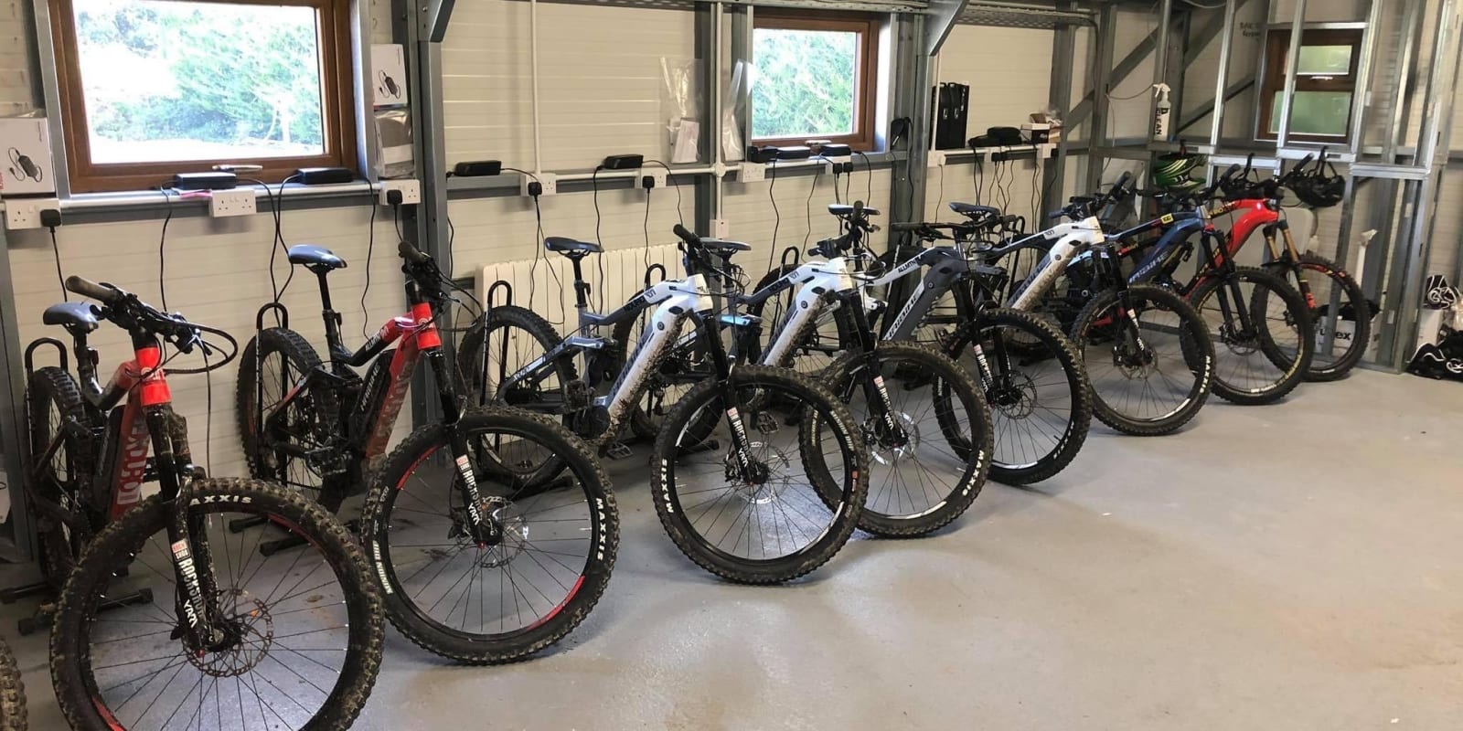 Bloom Eriders Header Mountain Bikes Parked And Charging