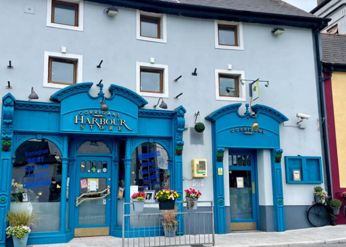 Blue Ornate Storefront Of Corrigans Harbour Store