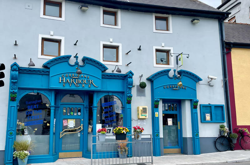 Blue Ornate Storefront Of Corrigans Harbour Store