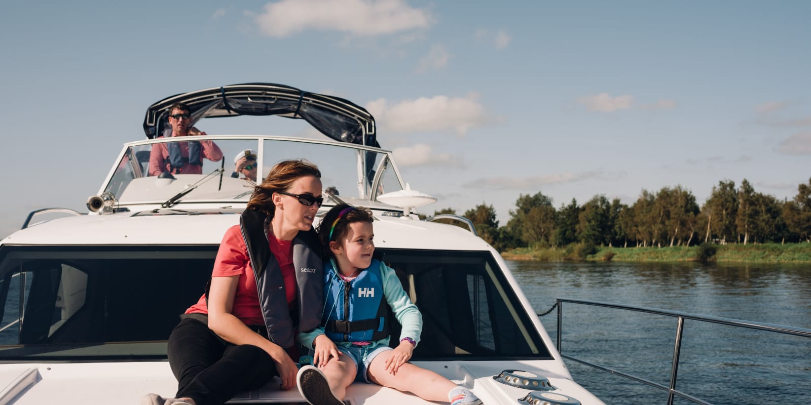 Carrickcraft Mother And Daughter On Boat Wearing Life Jackets