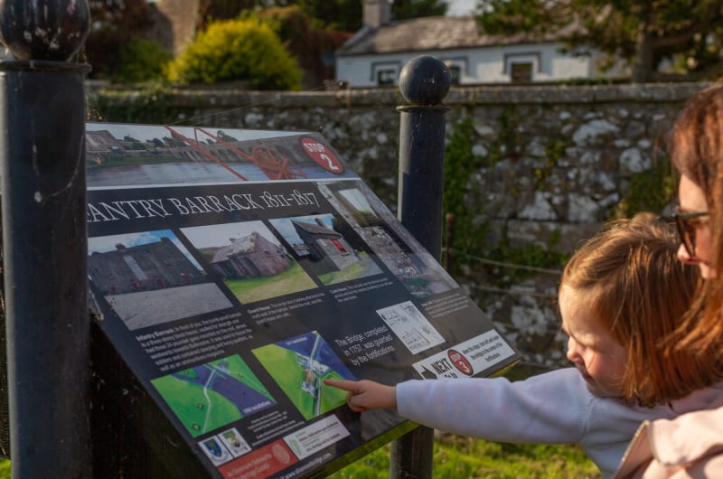 Child Pointing At Infantry Barrack Sign In Shannonbridge