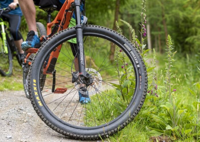 Close Up Of Mountain Bike Wheel On Trail aha28e