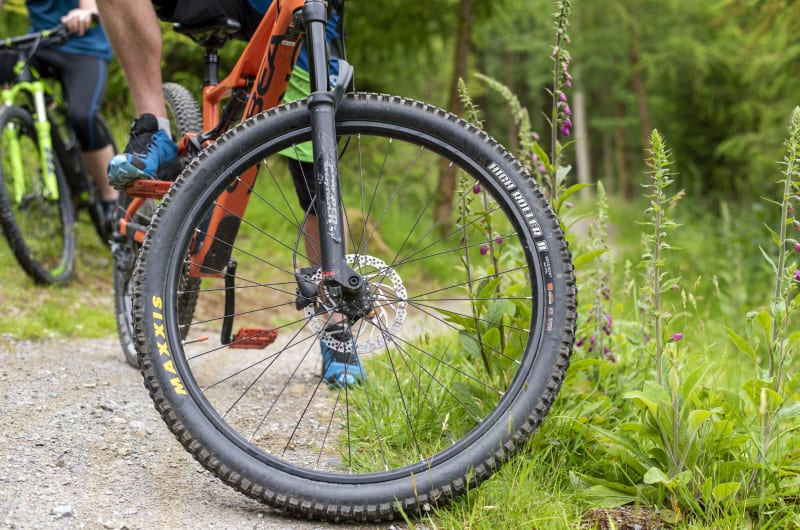Close Up Of Mountain Bike Wheel On Trail aha28e