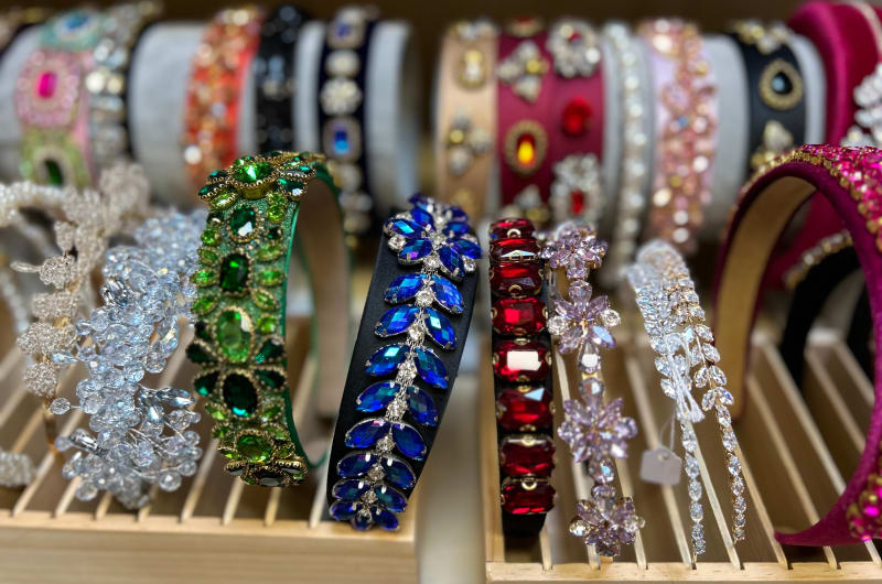 Colorful Jeweled Headbands Displayed On Wooden Stands