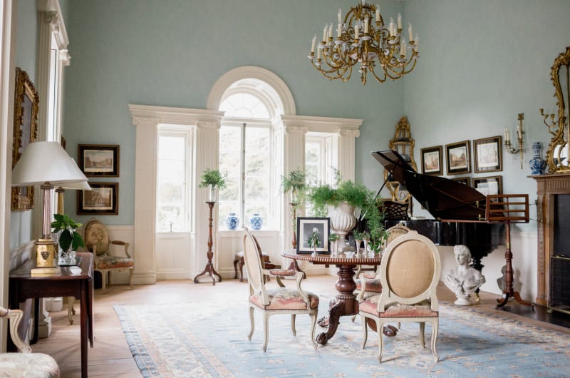 Elegant Drawing Room With Grand Piano And Chandelier