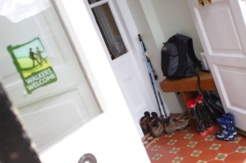 Entrance Hall With Hiking Gear And Welcome Sign