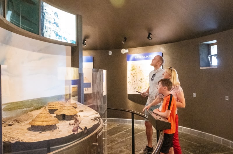 Family Viewing Historical Village Model At Clonmacnoise Museum