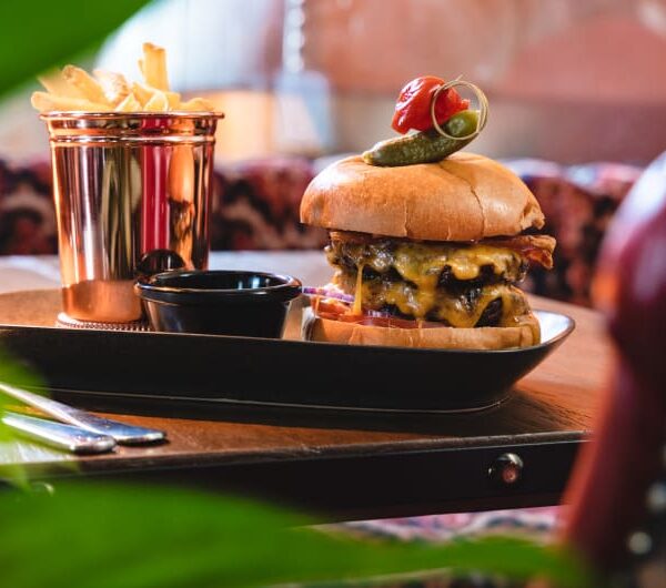 Gourmet double cheeseburger served with side of fries