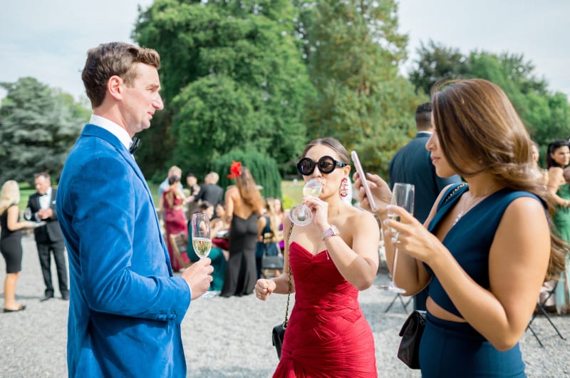 Guests In Formal Attire At An Outdoor Party