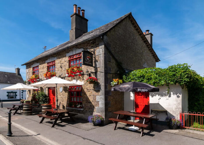 Hamiltons Pub Exterior With Red Windows And Seating