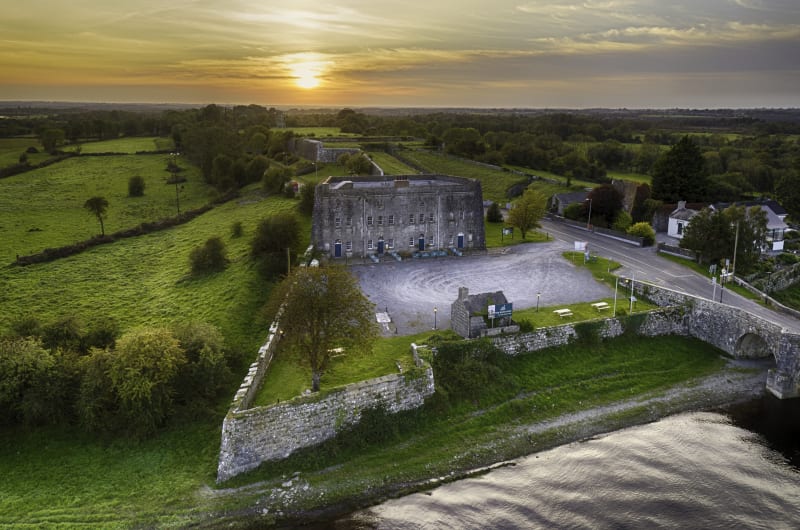 Historic Stone Fort Beside River During Golden Sunset