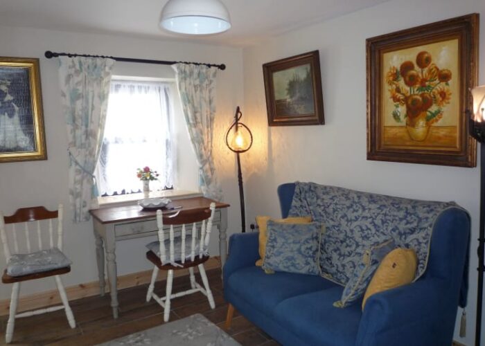 Living Room Interior With Blue Sofa And Paintings