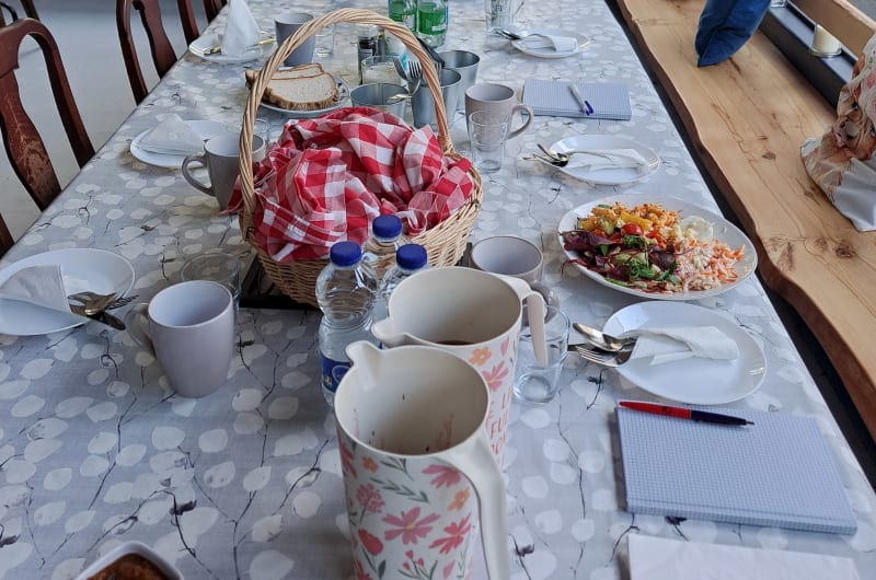 Long Dining Table Set With Food And Drinks
