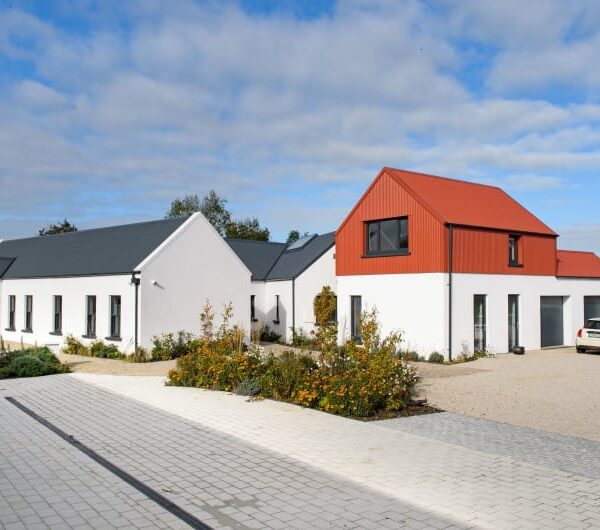 Modern White House With Red Corrugated Gabled Roof