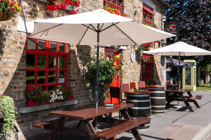 Outdoor seating area of Miltons brick pub