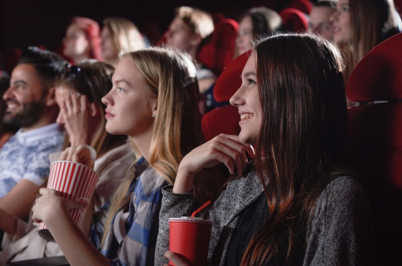 People Watching Movie In Cinema Theater
