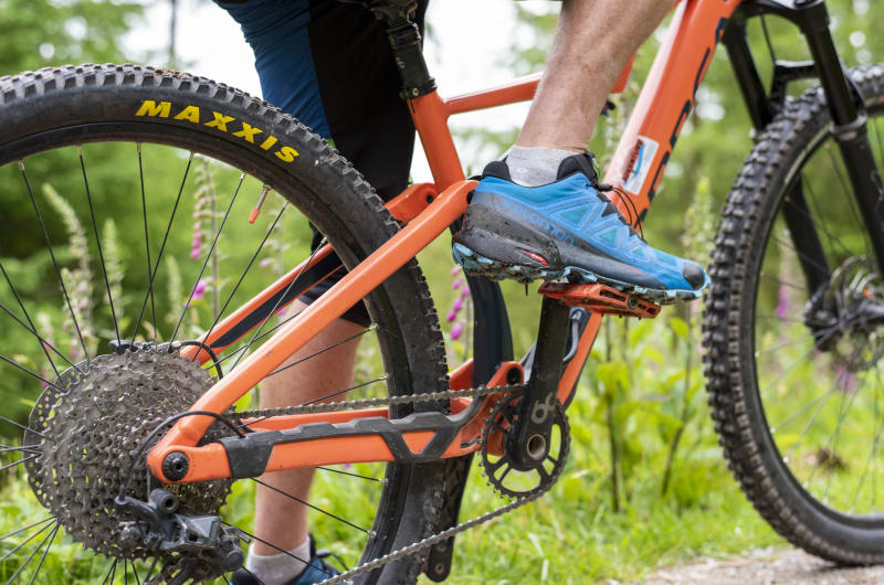 Person Riding Orange Mountain Bike On Forest Trail d1np7p