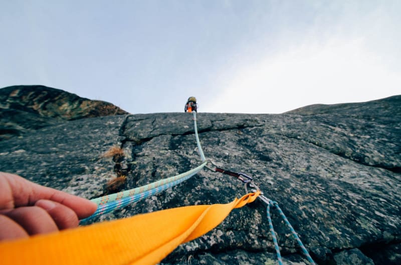 Pov Rock Climbing With Ropes And Orange Webbing