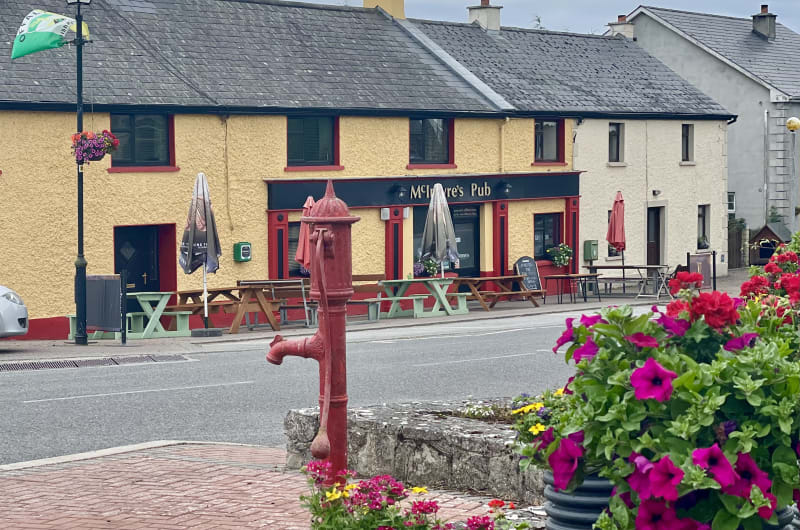 Red Water Pump In Front Of Mcintyres Pub