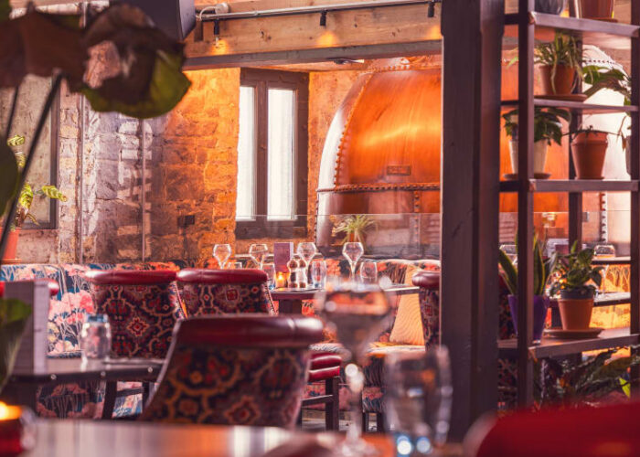 Restaurant Dining Area With Large Copper Still