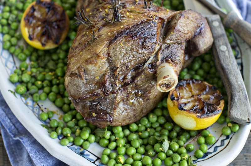 Roasted Leg Of Lamb With Peas And Lemons
