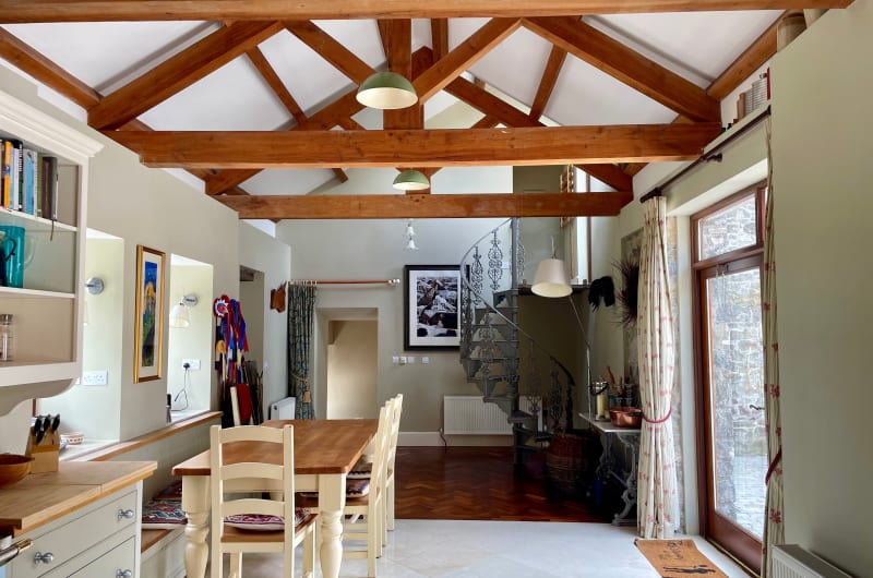 Rustic Interior With Vaulted Ceiling And Spiral Staircase