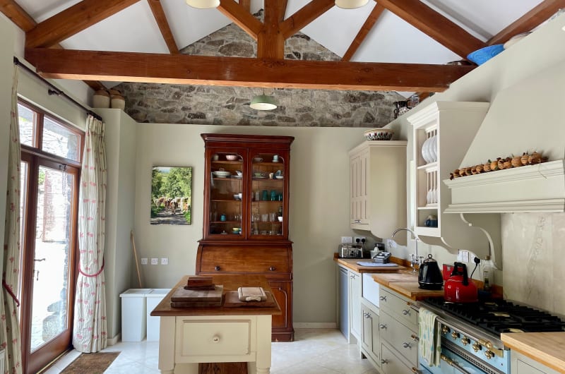 Rustic farmhouse kitchen with exposed beams and island