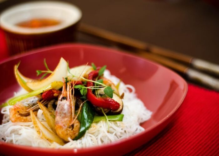 Shrimp Noodle Dish With Vegetables In Red Bowl
