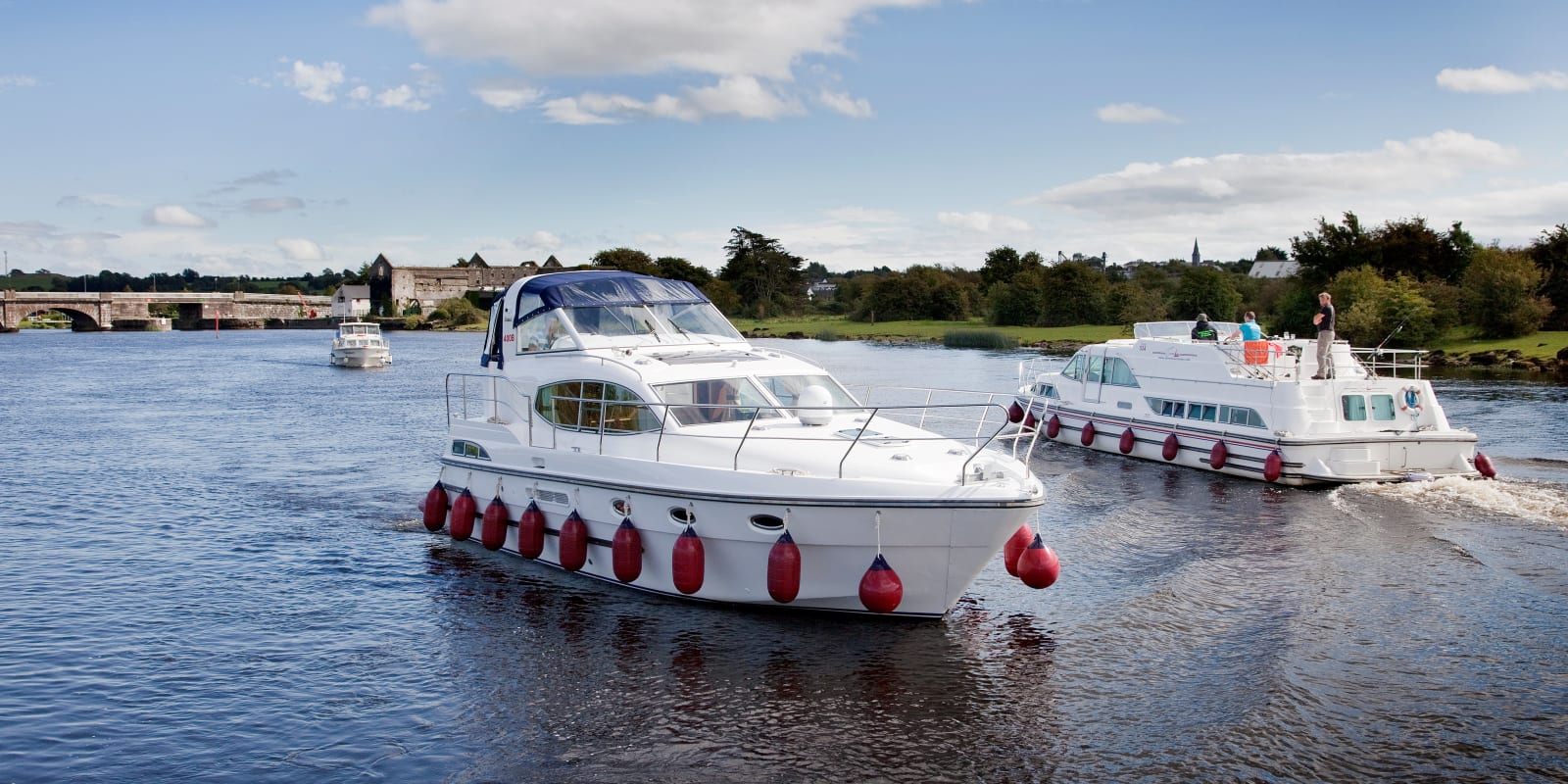Silverline Cruisers White motor yachts on a scenic river