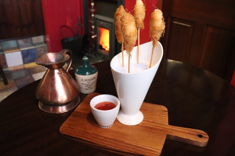 Skewered Fried Appetizers With Red Dipping Sauce