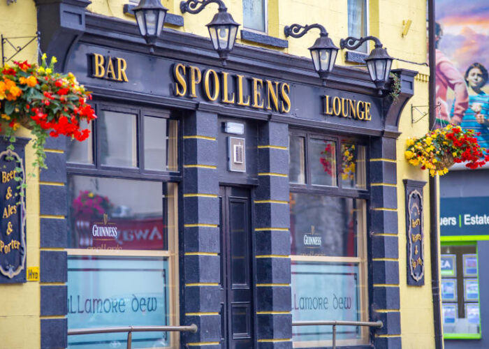 Spollens Bar Lounge exterior with hanging flower baskets