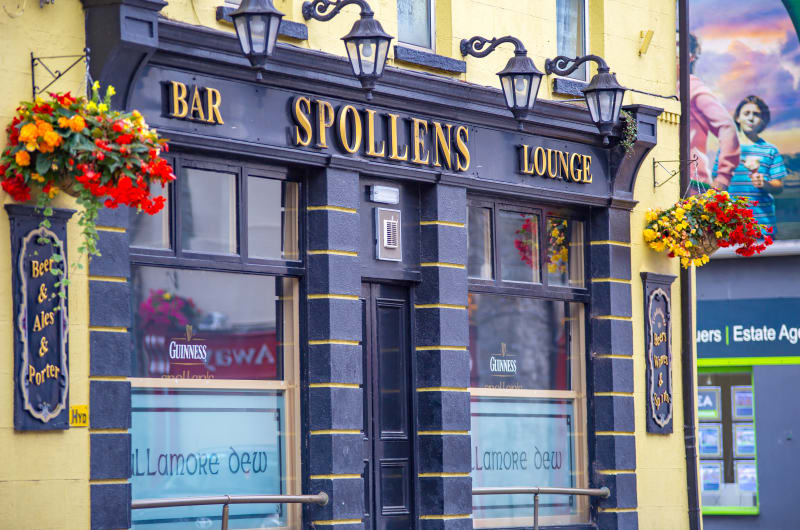 Spollens Bar Lounge exterior with hanging flower baskets