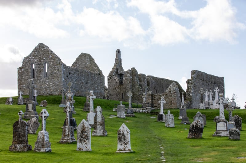 Stone Church Ruins And Cemetery With Celtic Crosses