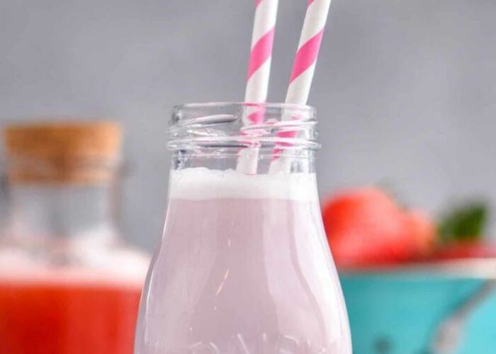 Strawberry Milk In Bottle With Striped Straws