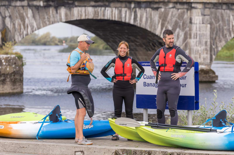 Three Kayakers In Wetsuits At Banagher Harbour