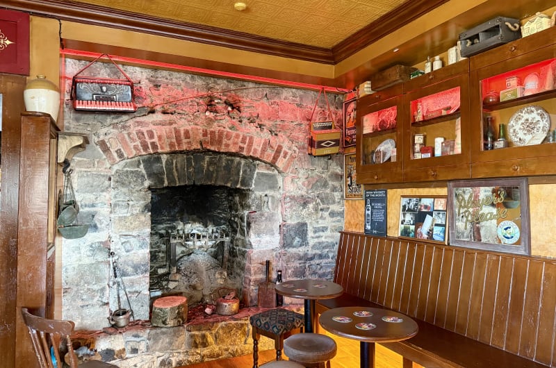 Traditional Irish Pub Interior With Stone Fireplace