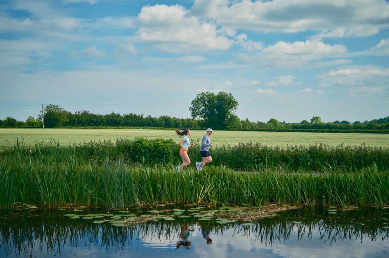 Two People Running Along Grand Canal Way Offaly