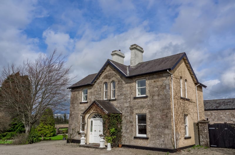 Two Story Stone House With Gabled Porch