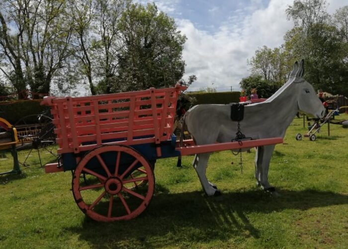 Wooden Donkey Statue Pulling A Pink Garden Cart