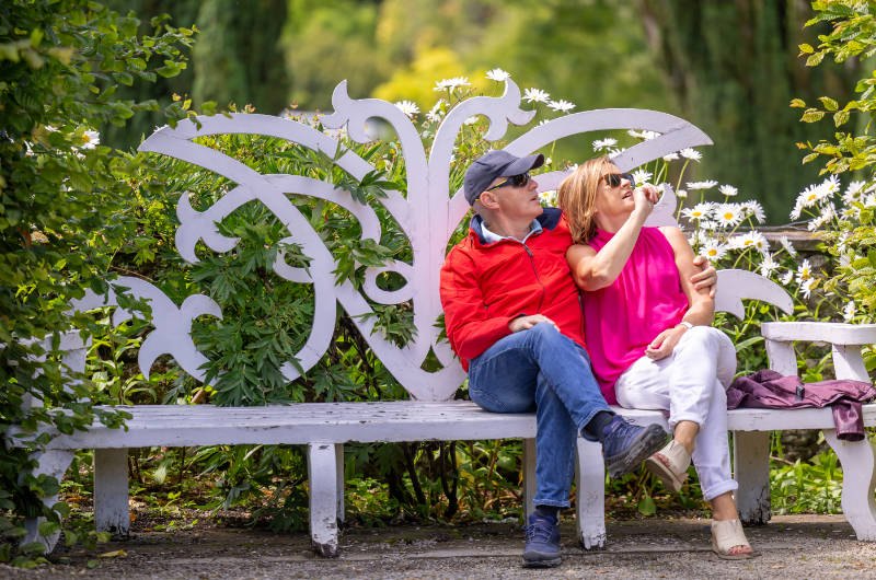 couple on white garden bench