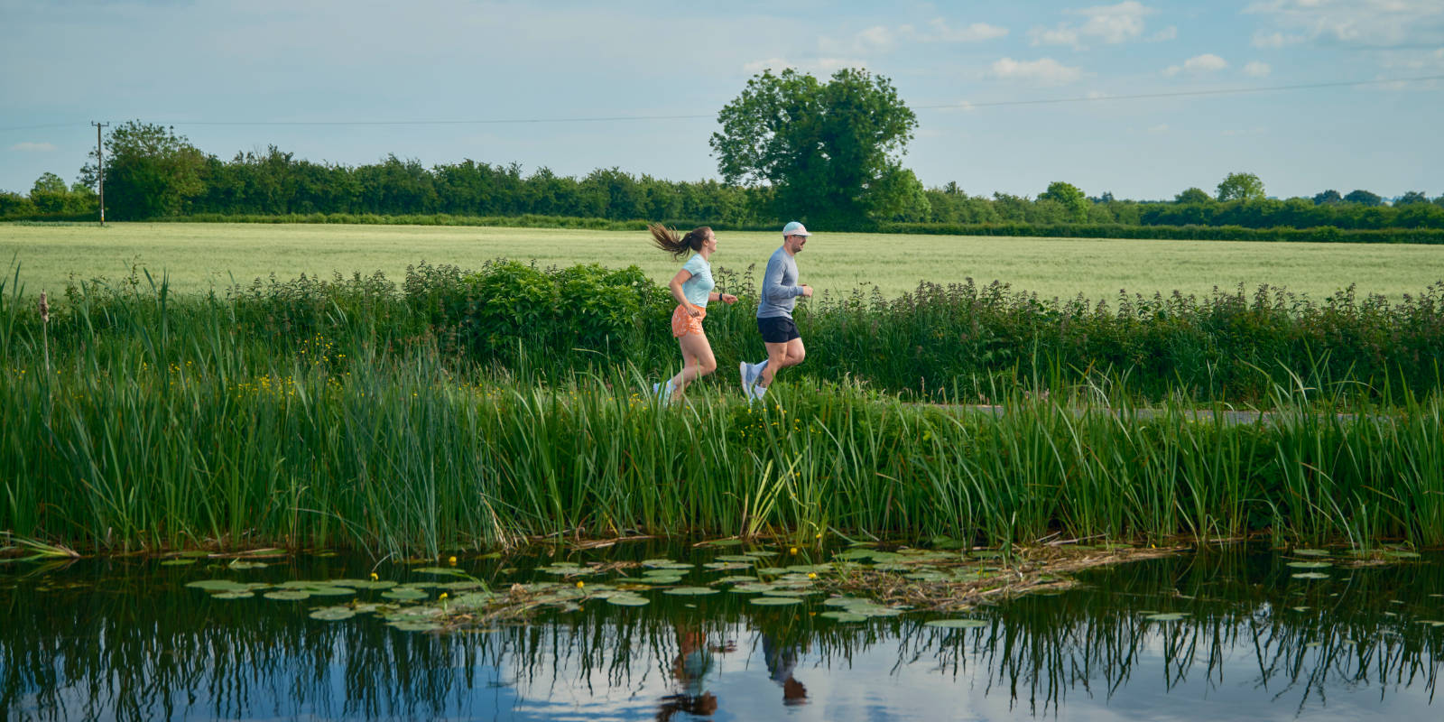 header joggers on river bank