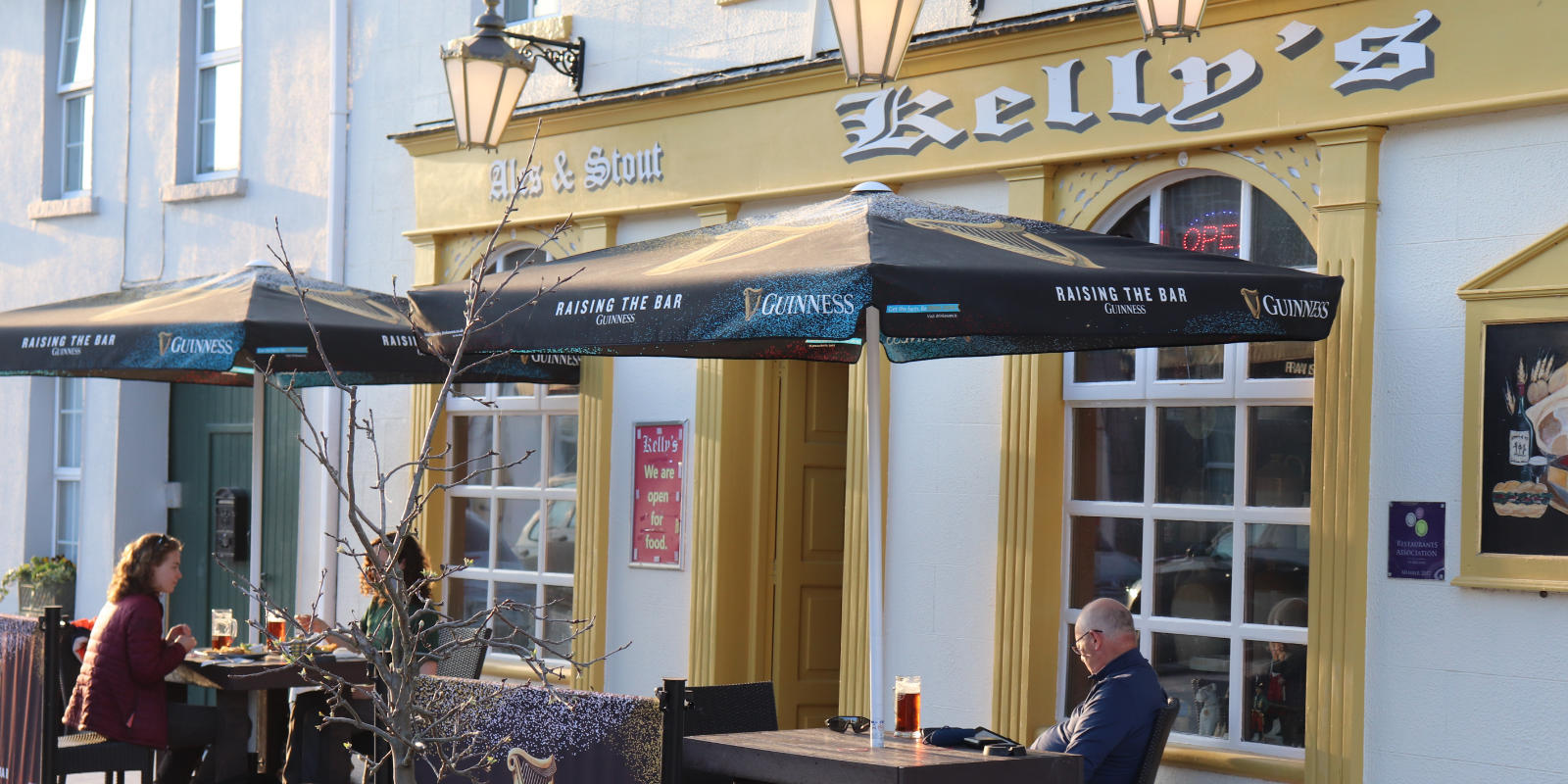 kellys bar pub people outside header